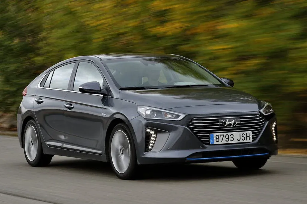 Hyundai Ioniq 9 electric three-row SUV driving on a suburban road